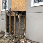 Exterior wall damage after fire requiring structural repair and restoration